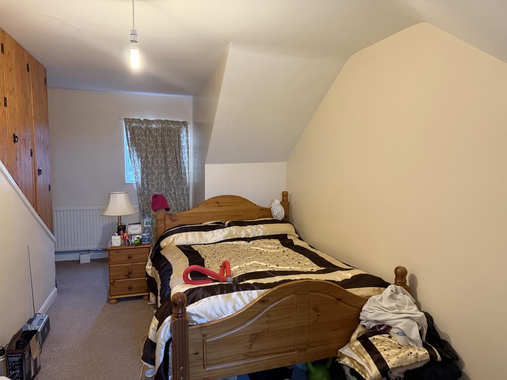 Lot: 169 - TWO-BEDROOM FIRST FLOOR MAISONETTE - Bedroom on second floor with painted magnolia walls